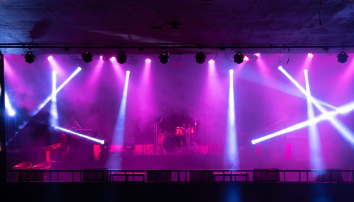 Empty stage concert with colorful lighting laser beam spotlight show in disco pub club bar background for party music dancing festival performance. Entertainment nightlife. Celebration event.